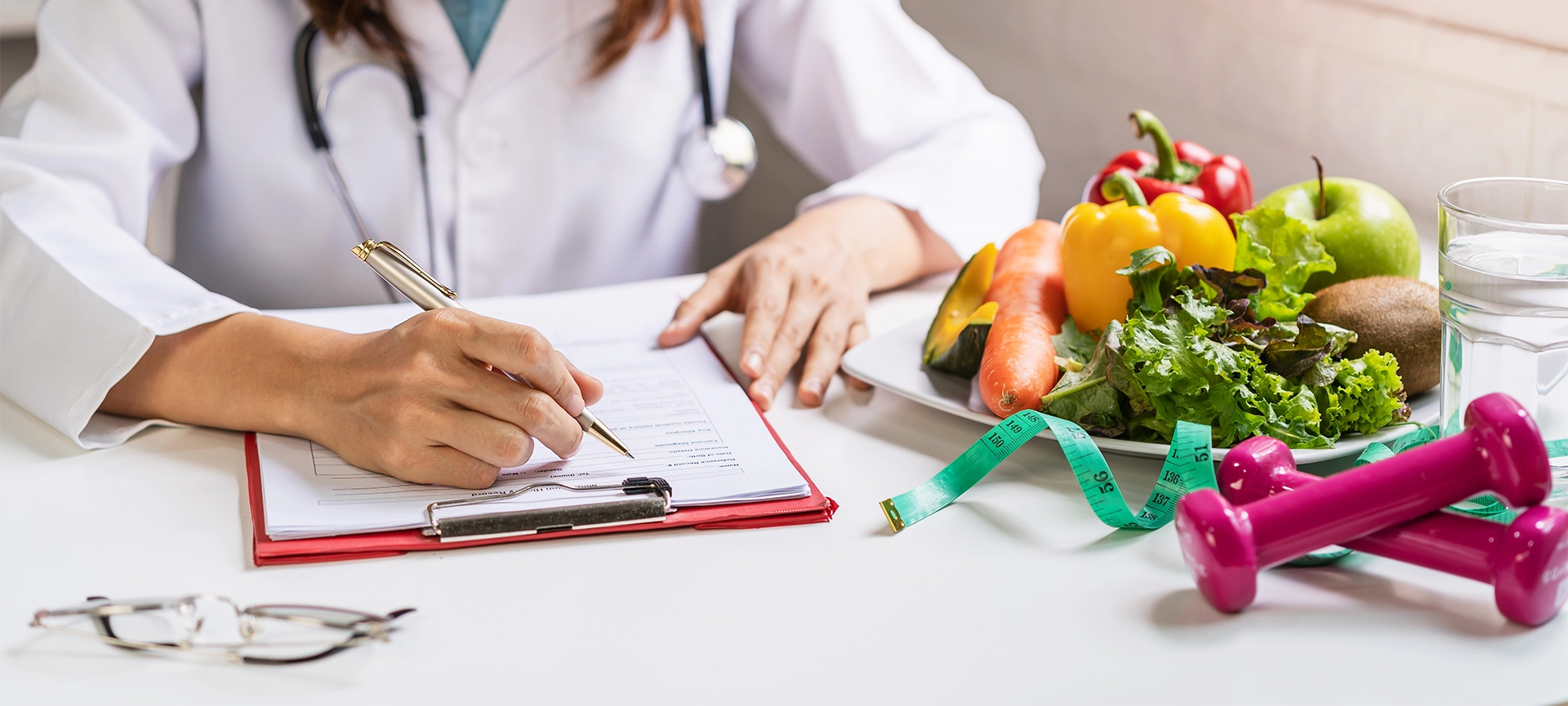 nutritionist giving consultation to patient with healthy fruit and vegetable